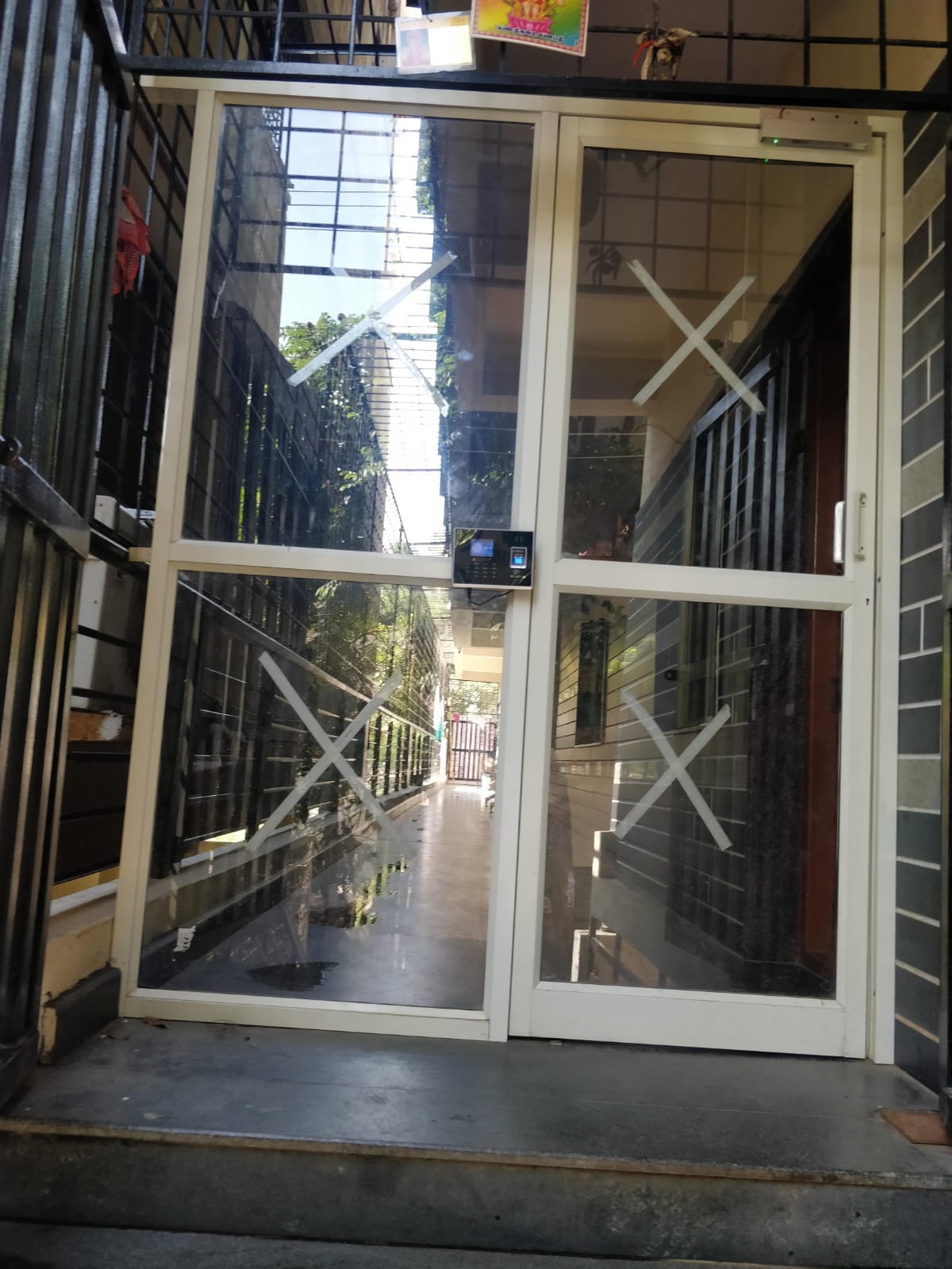 Biometric fingerprint entry at the main glass door